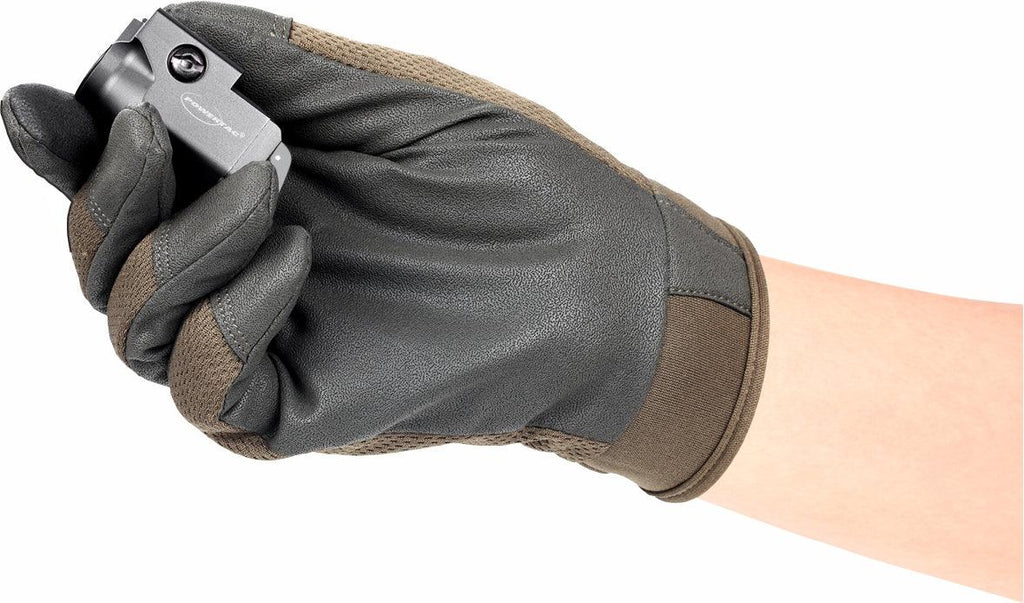 Gloved hand holding compact black light.