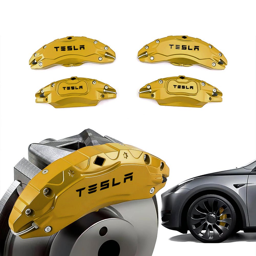 Gold-tone Tesla caliper covers with wheel illustrations.