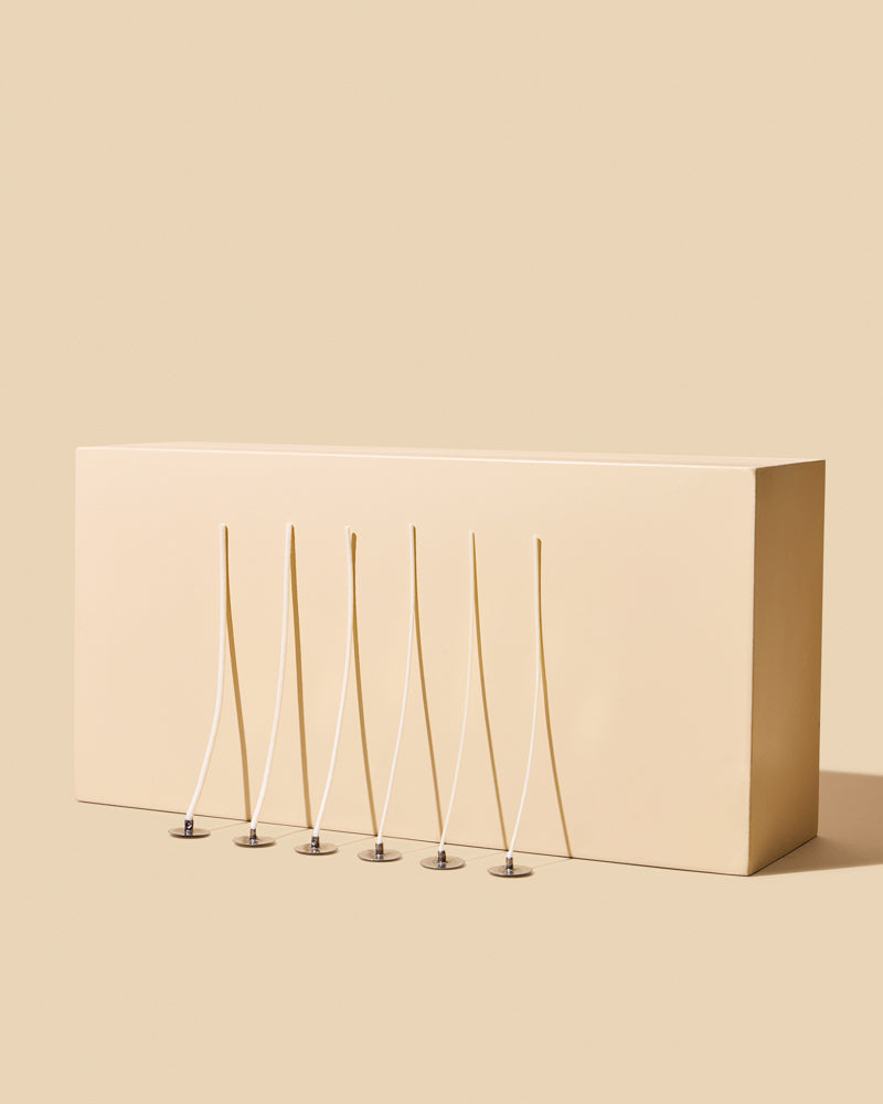 Thin wooden sticks beside packaging.
