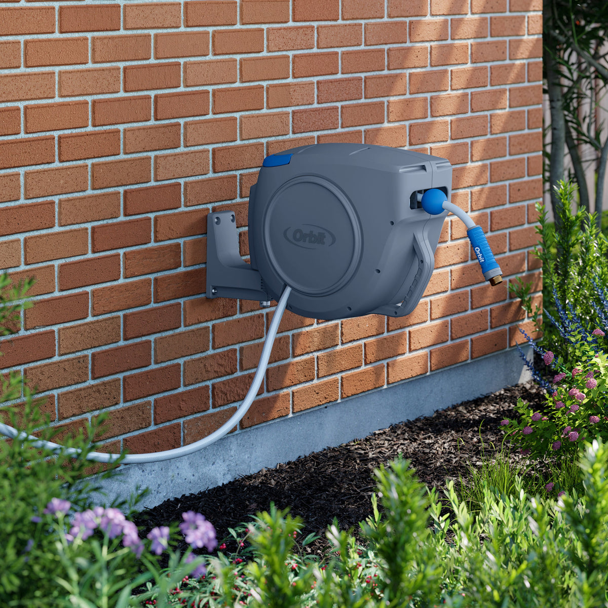 Hose reel mounted on brick wall.