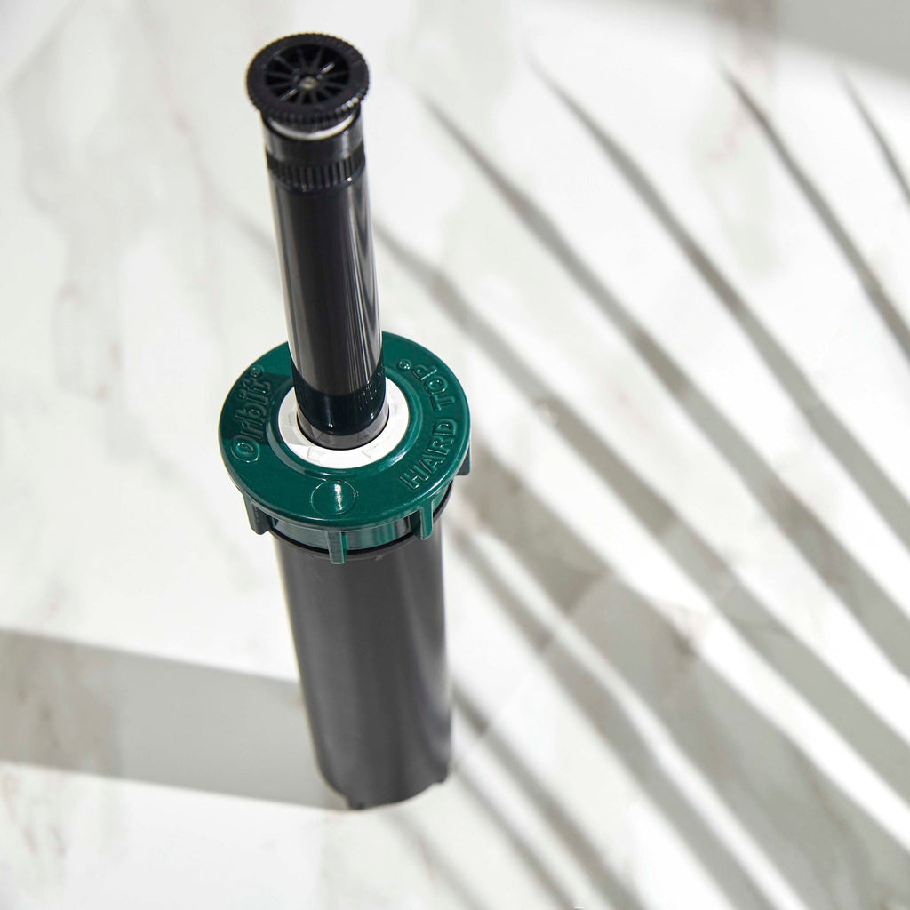 Top angled view of extended pop-up sprinkler.