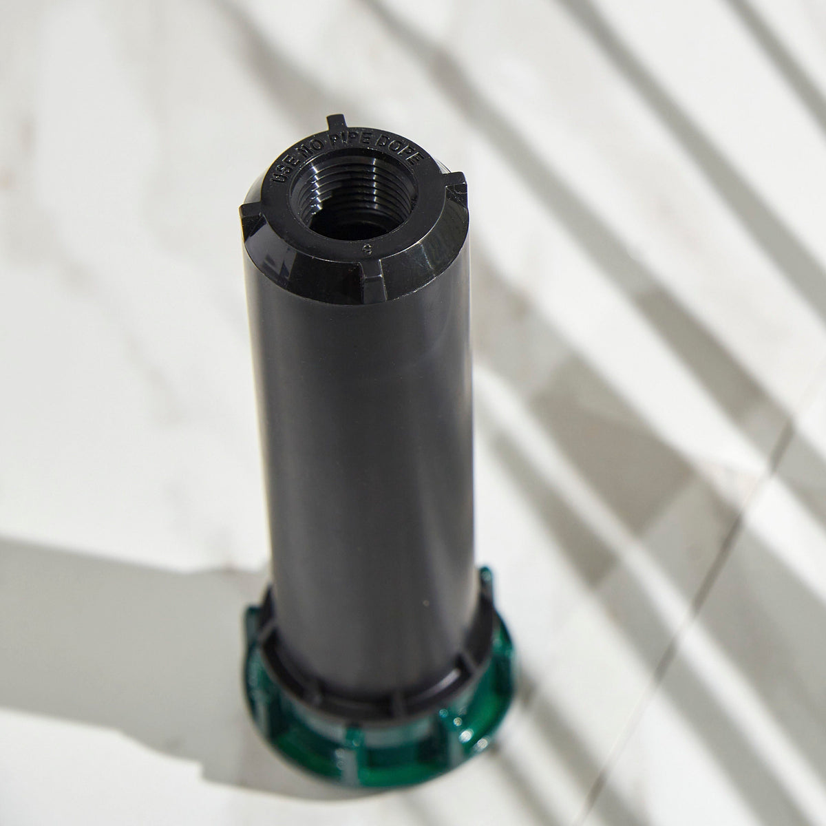 Close-up of retracted sprinkler head.