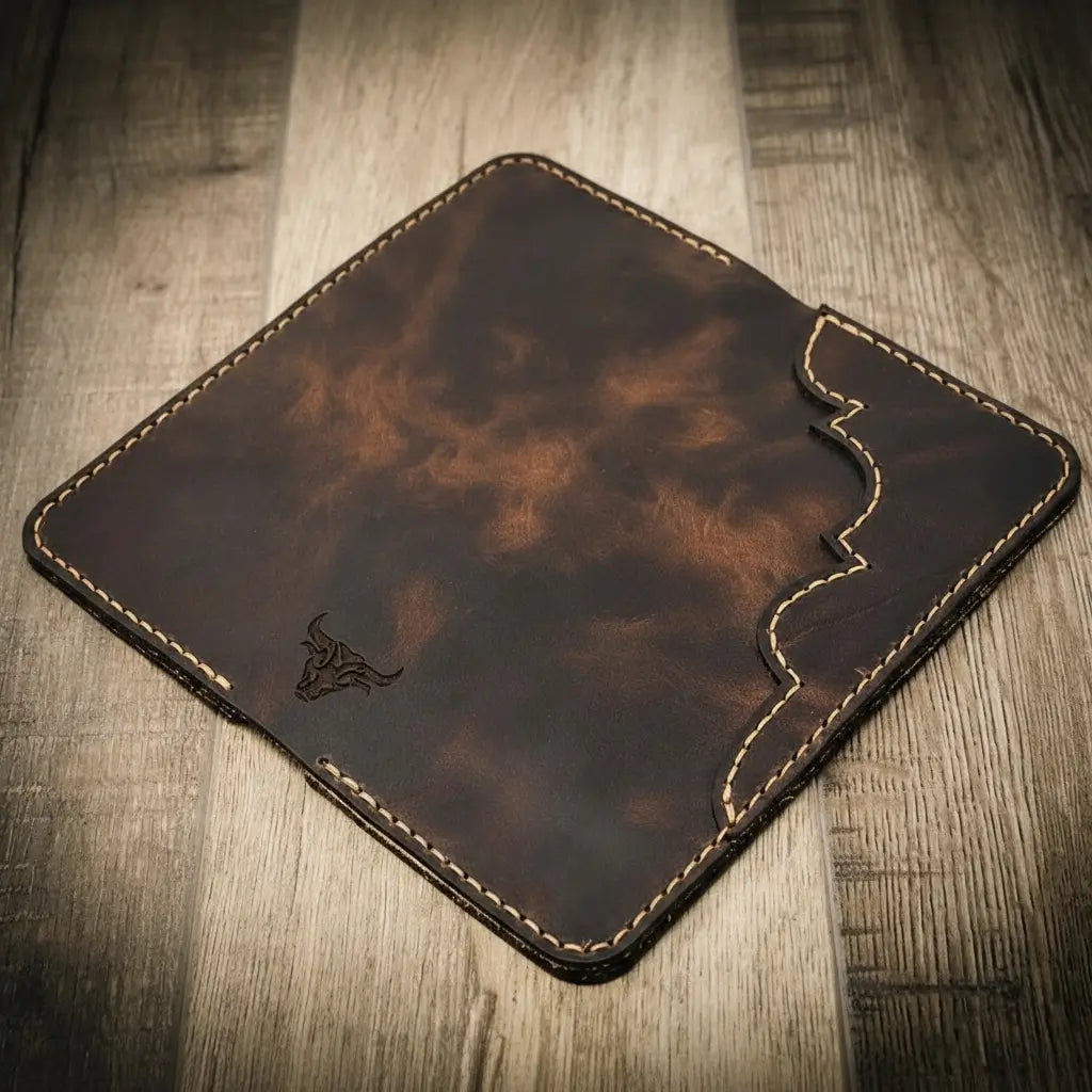 Closed dark brown wallet with wavy stitched edge and small logo.