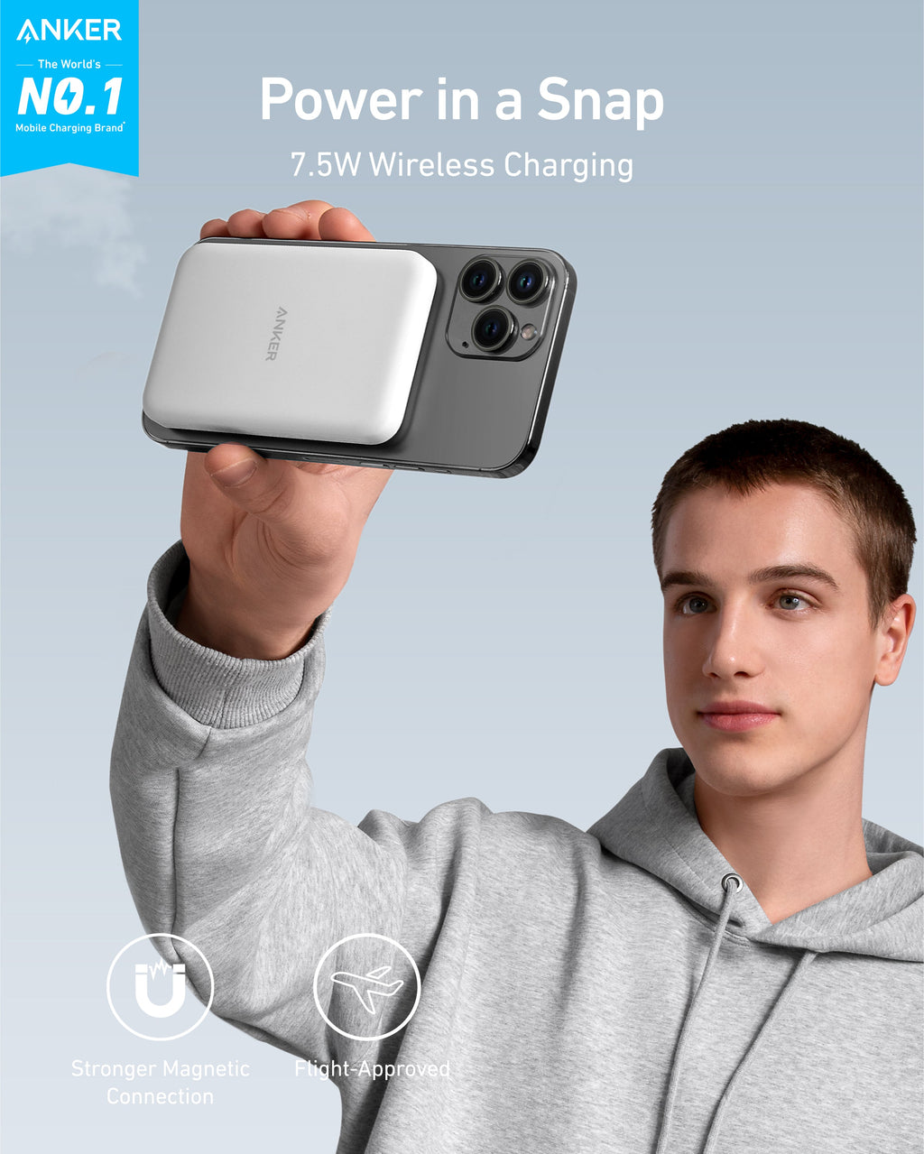 Person using white magnetic power bank.