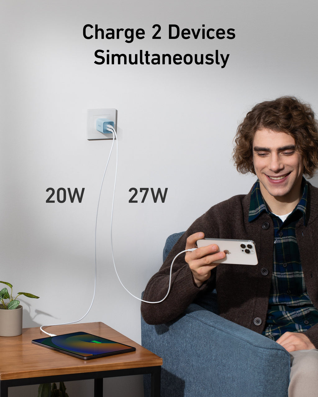 Blue wall charger charging two devices.