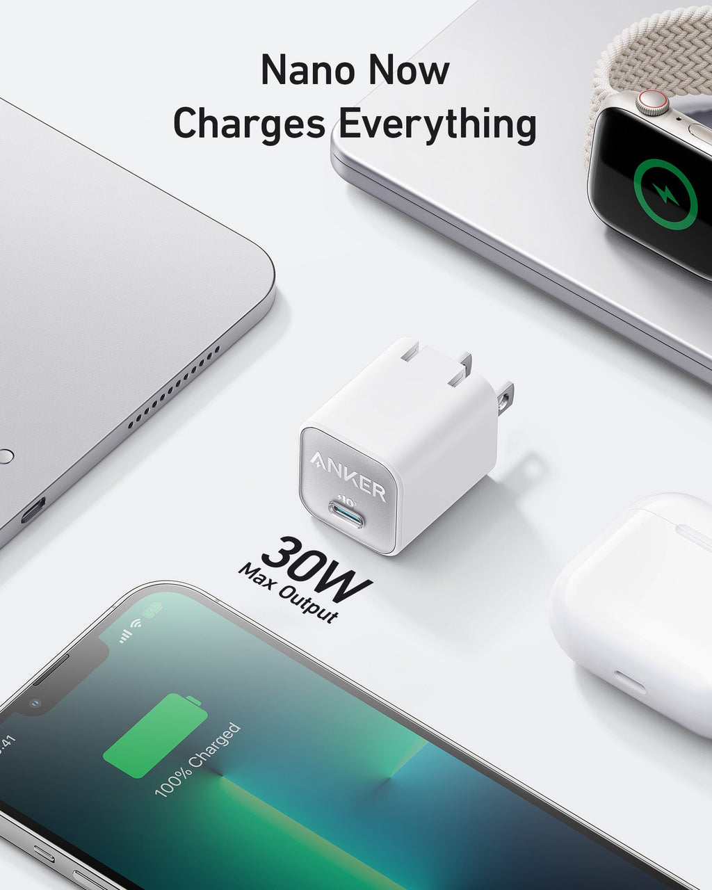 White charger beside laptop.