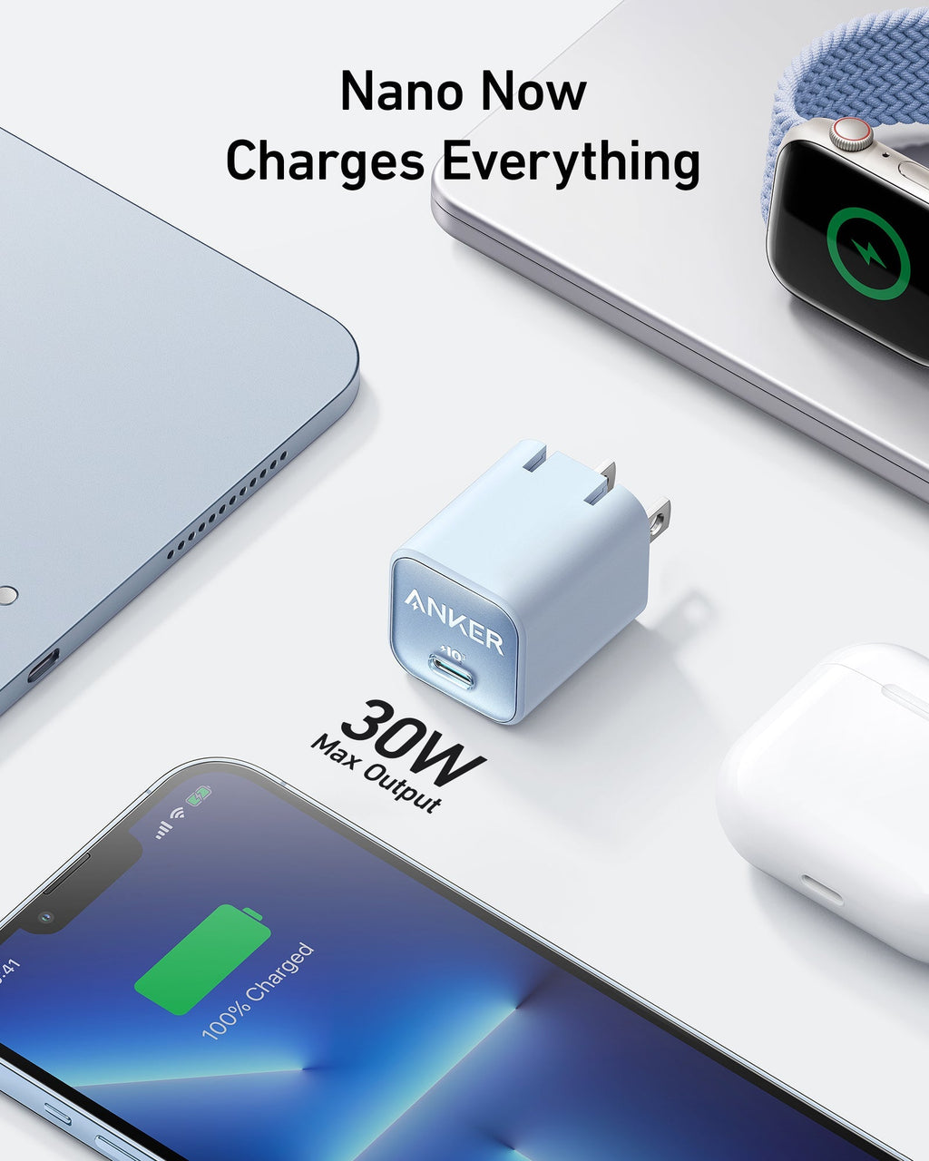 Light blue charger beside laptop.