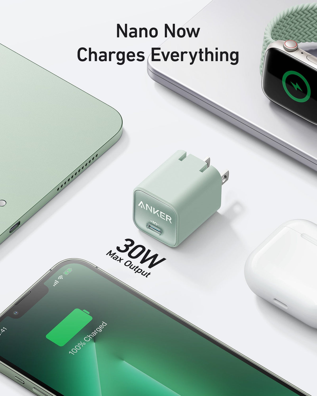 Pale green charger beside laptop.