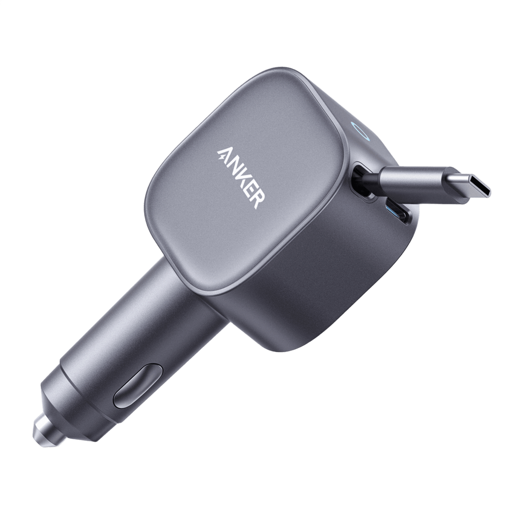 Gray car charger on green background.