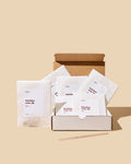Small white sachets beside open box.