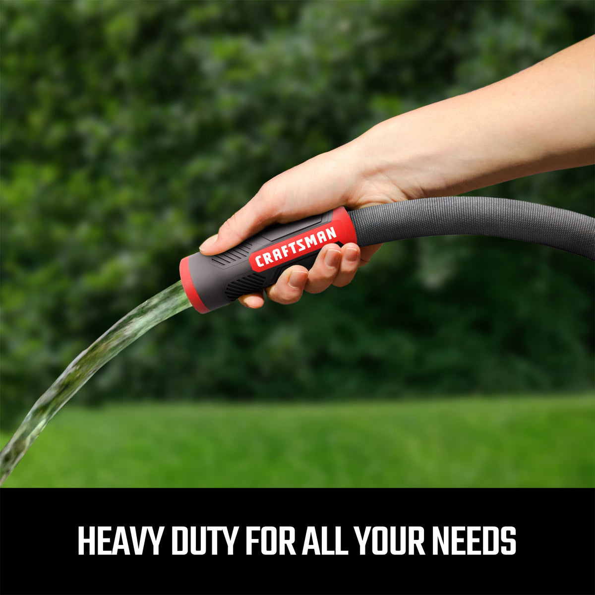 Hand spraying water through Craftsman hose.