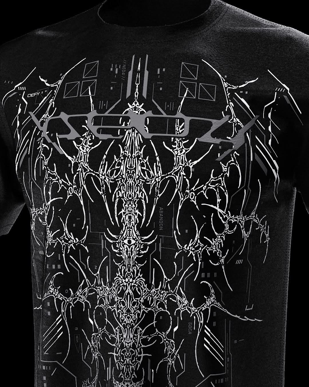 Close-up of upper gray ornamental artwork on black T-shirt.