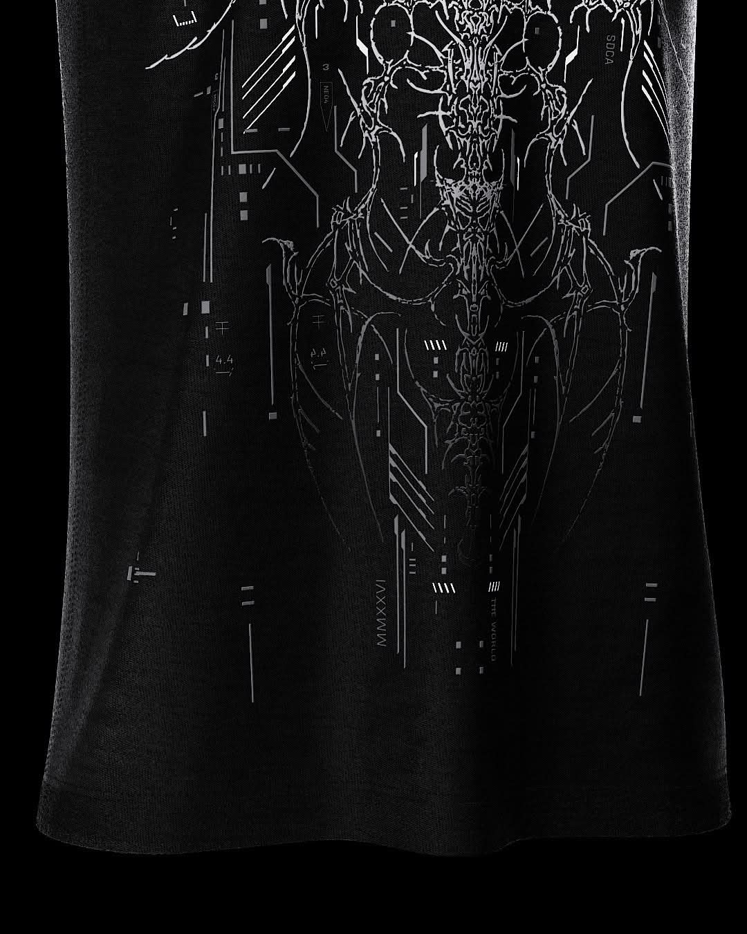 Close-up of fine gray artwork near black T-shirt hem.