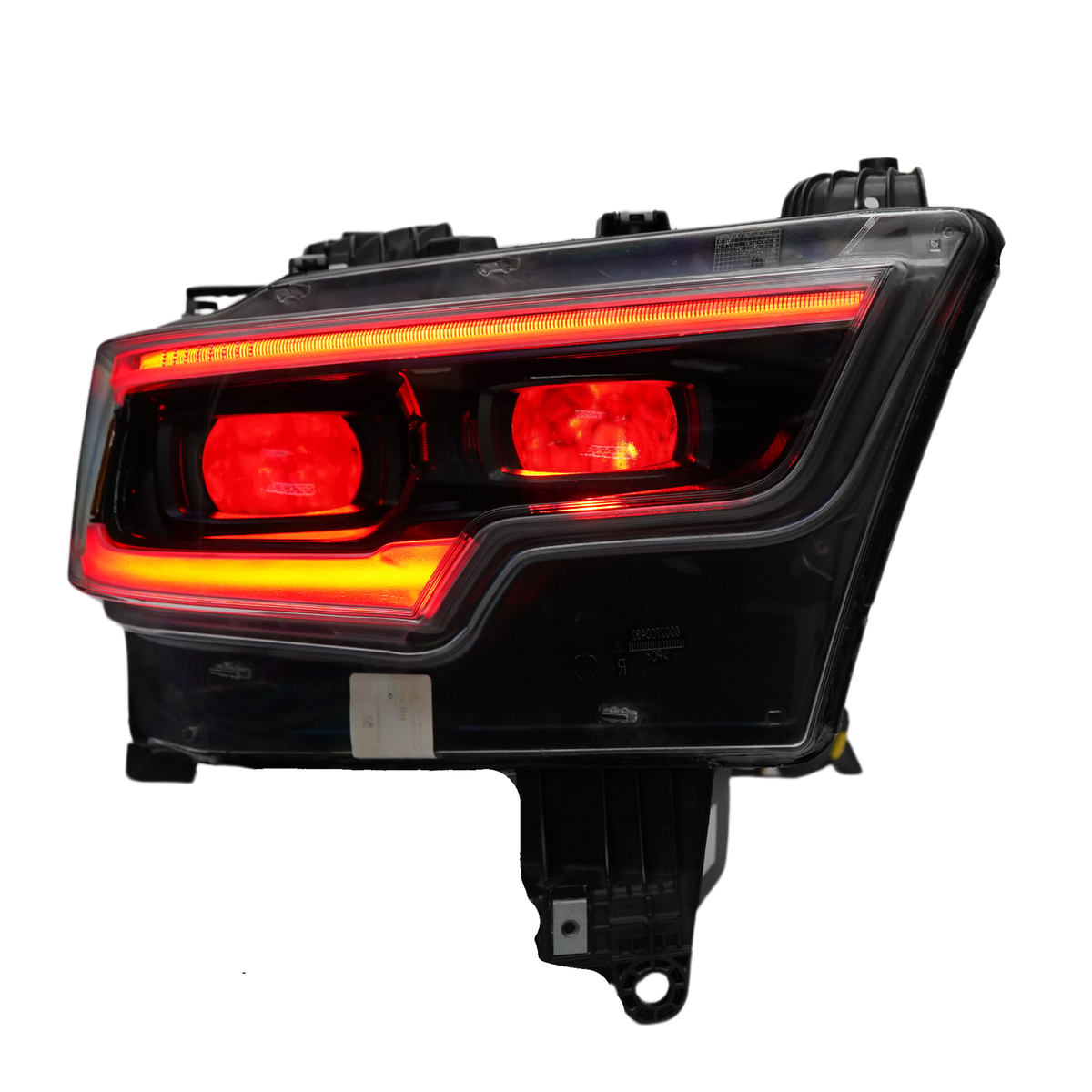 Single headlight assembly with red lights and outline.