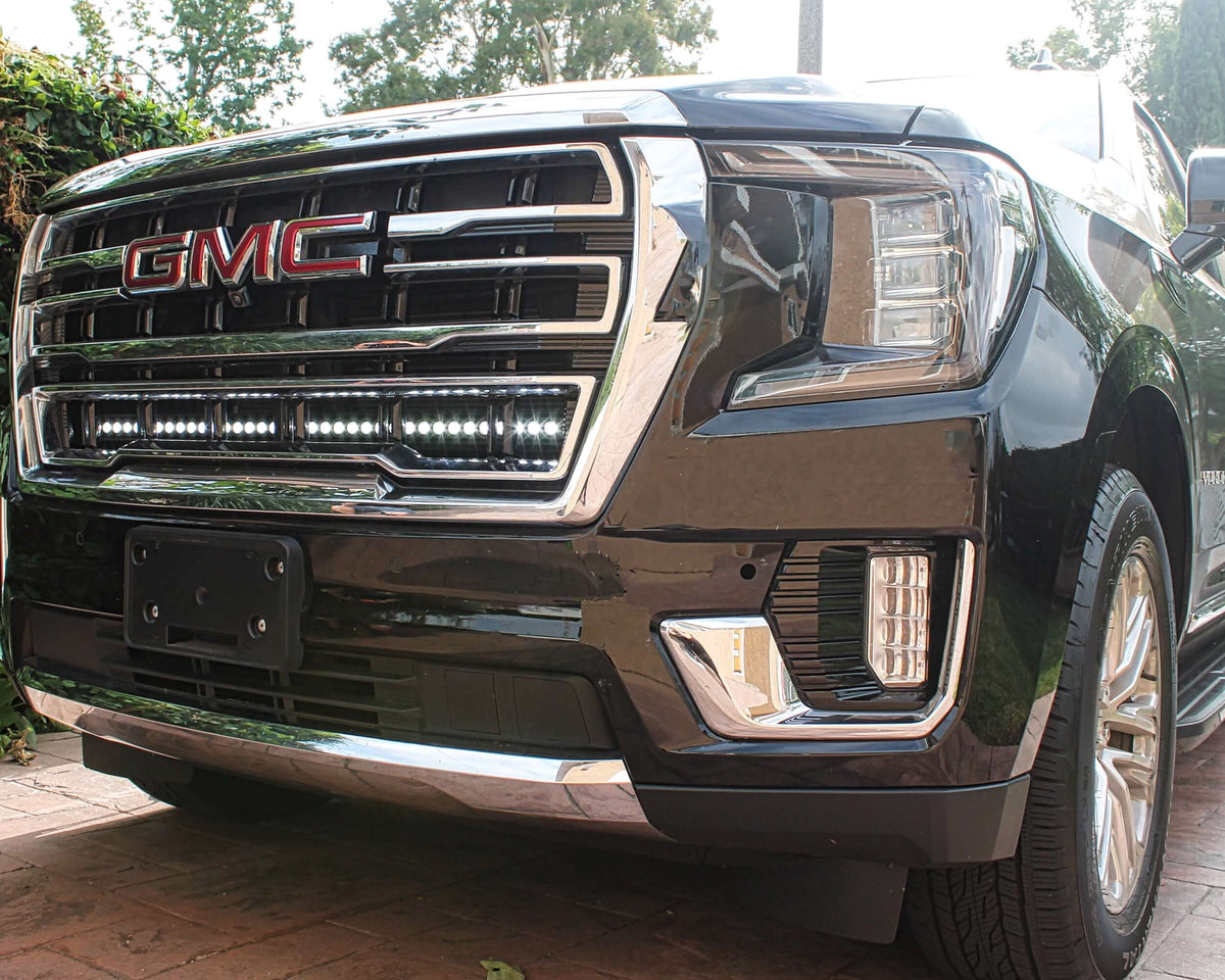 Close-up of GMC grille with installed LED light bar.