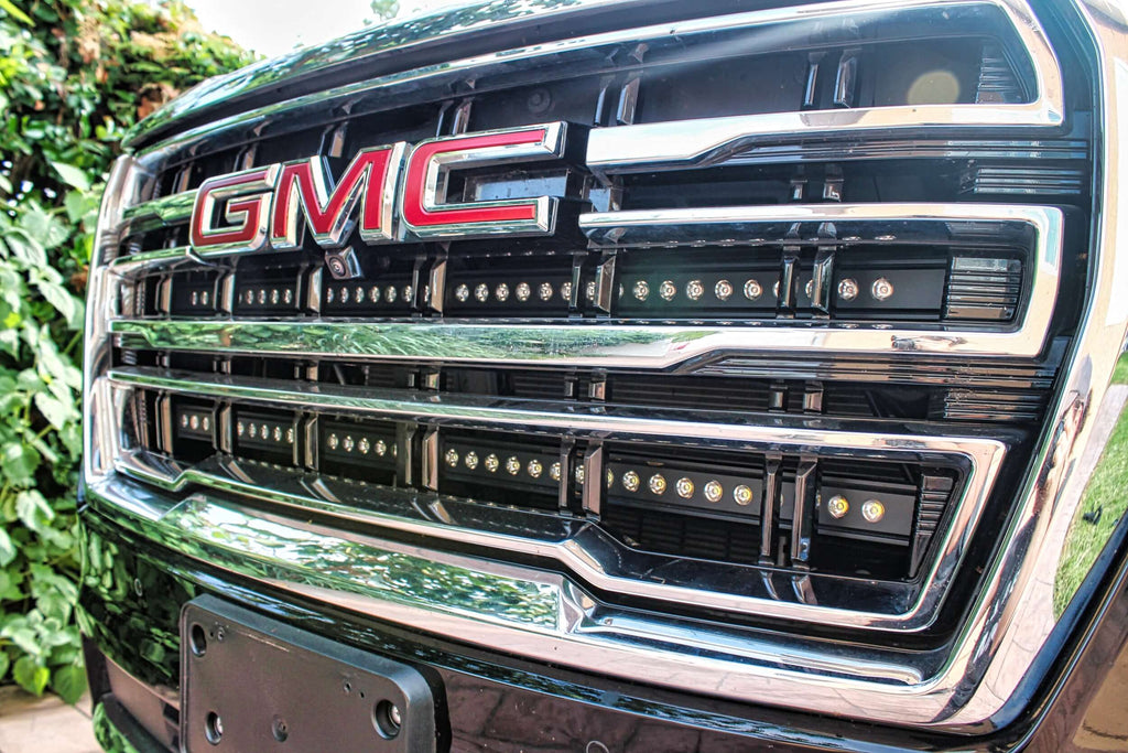 Close-up of GMC grille with installed LED light bar.