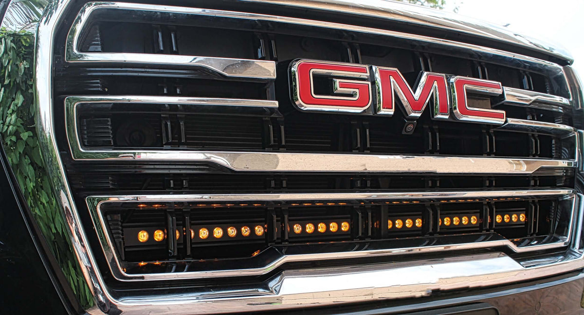 Close-up of GMC grille with installed LED light bar.
