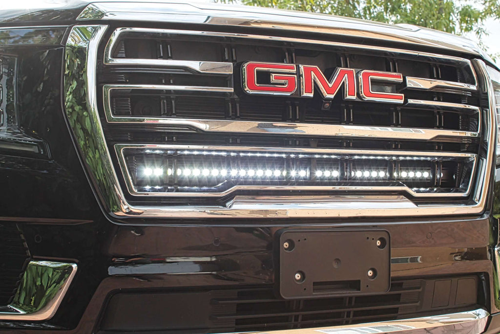 Close-up of GMC grille with installed LED light bar.