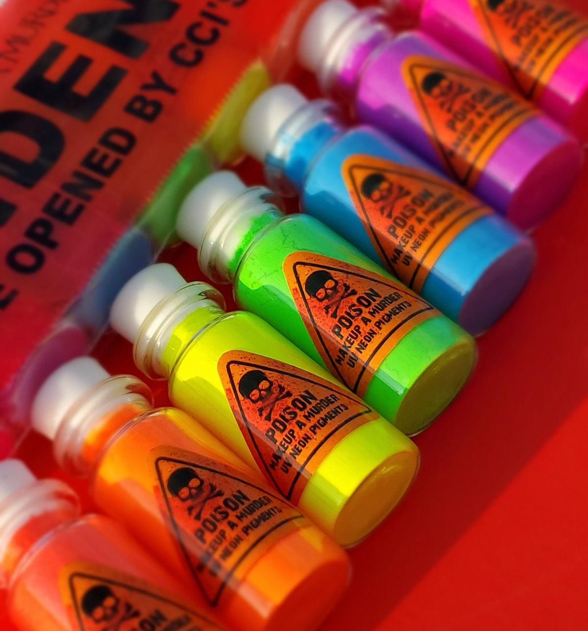 Assorted bright cosmetic bottles arranged together.