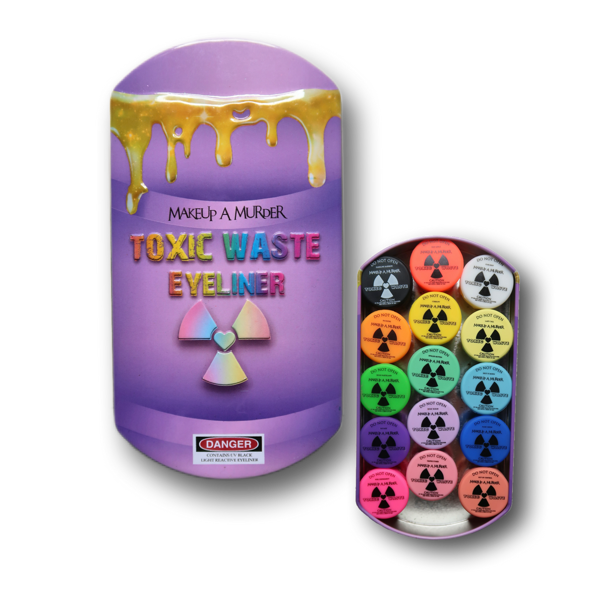 Purple Toxic Waste Eyeliner packaging beside colored cosmetic pots.