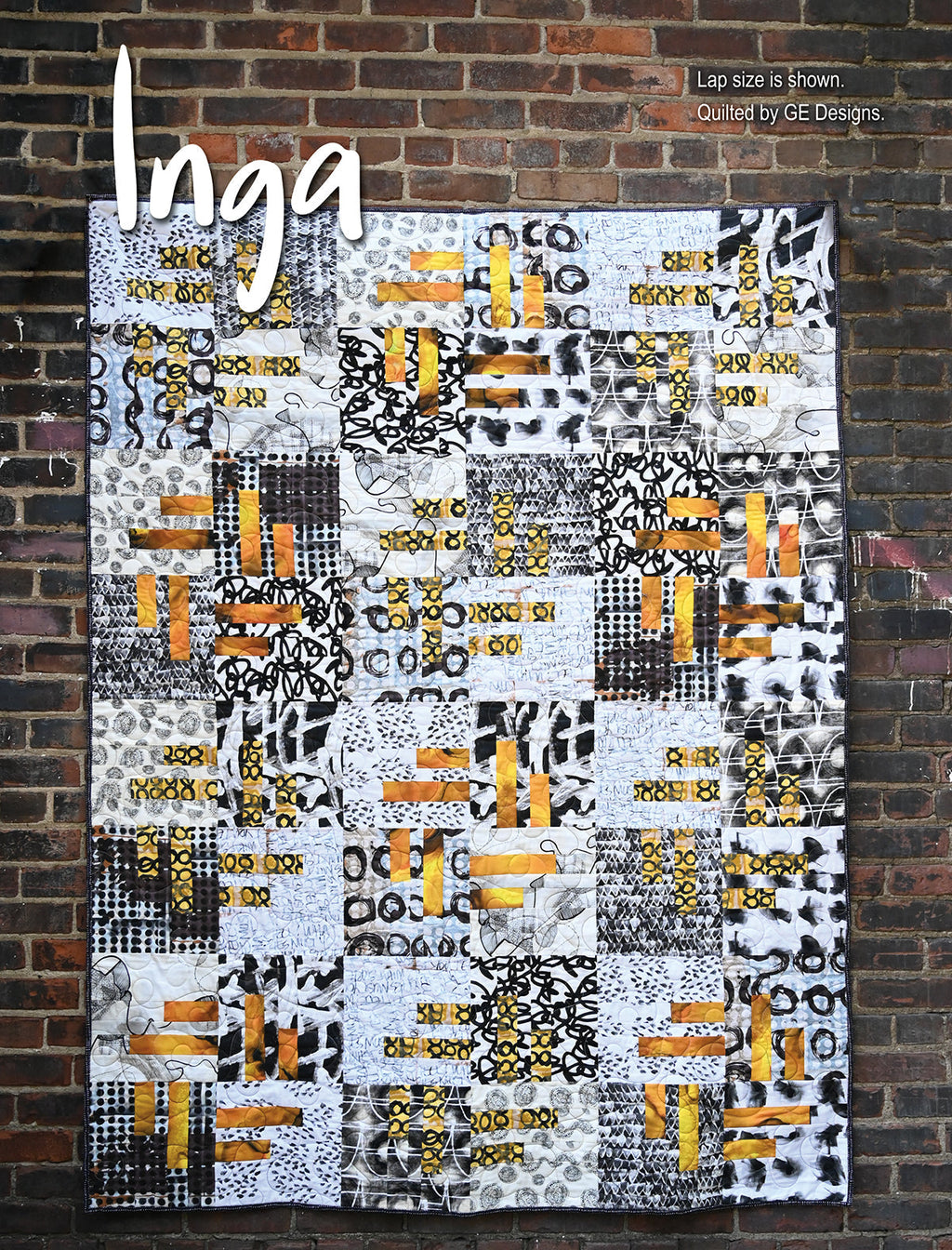 Gray, white and yellow quilt labeled Inga.