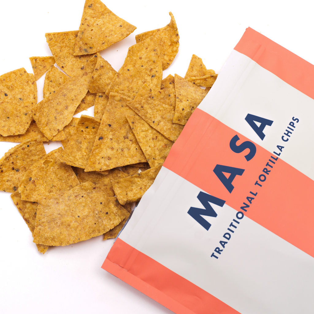Masa snack bag with chips spilling beside it.