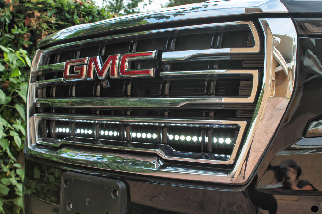 Close-up of GMC grille with installed LED light bar.