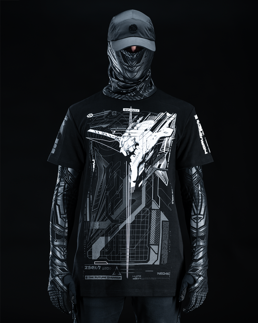 Front view of masked model wearing black T-shirt with gray technical artwork.