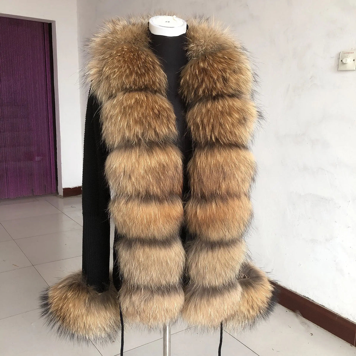 Long tan fluffy vest viewed from side.