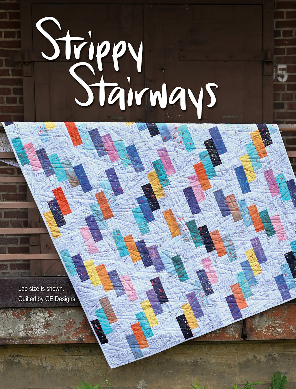 Striped patchwork quilt labeled Strippy Stairways.