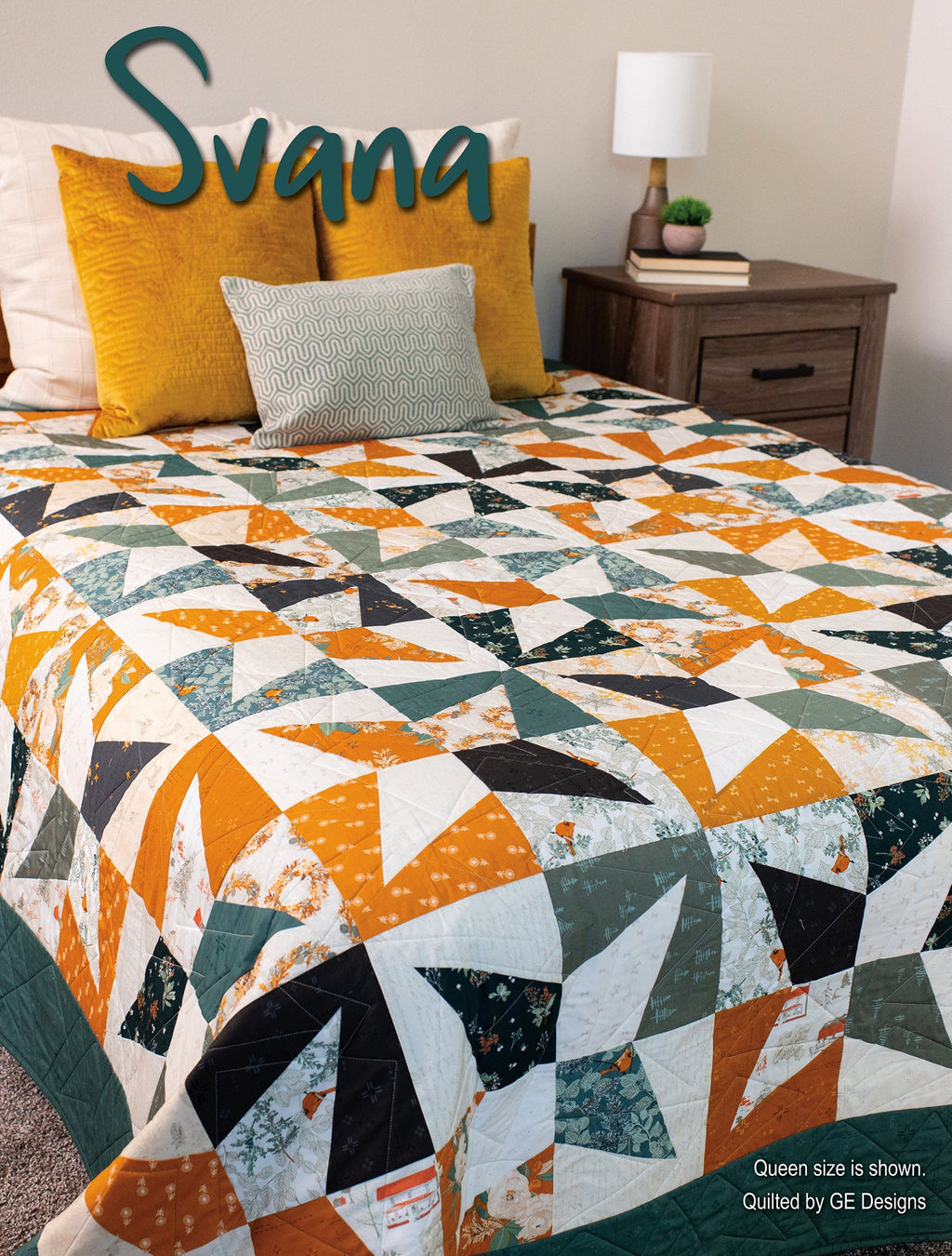 Orange, black and white quilt labeled Svana on a bed.