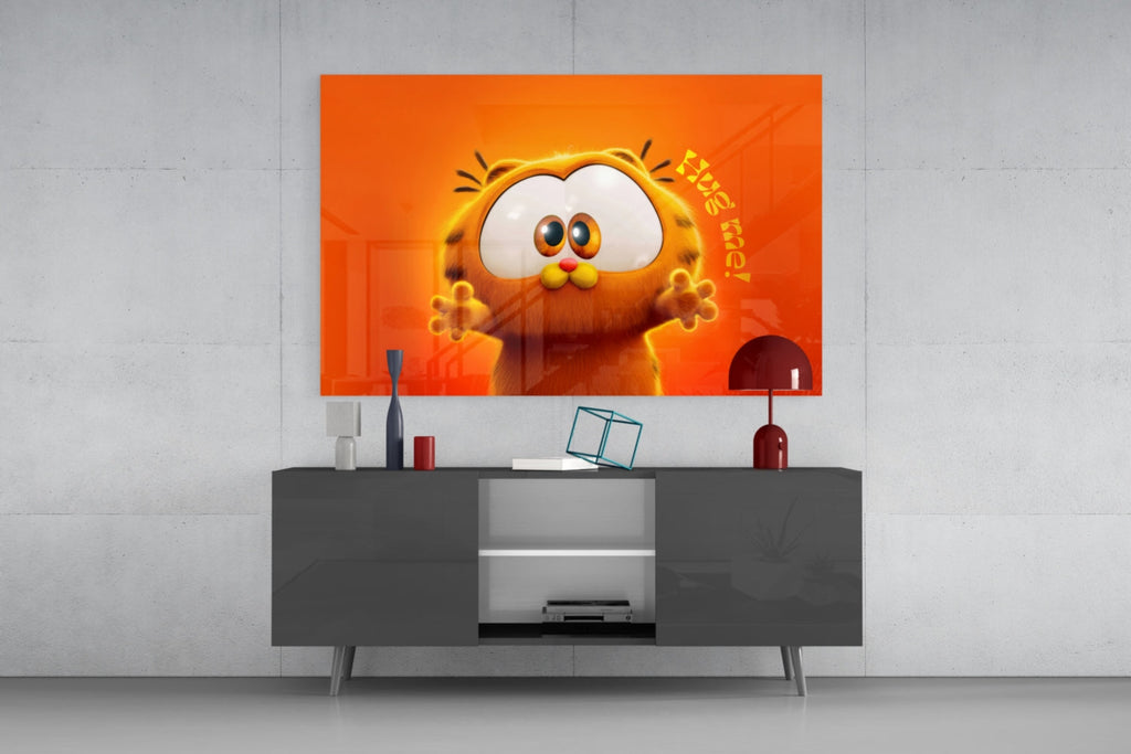 Wall art depicting Garfield's face on an orange background above a gray console.