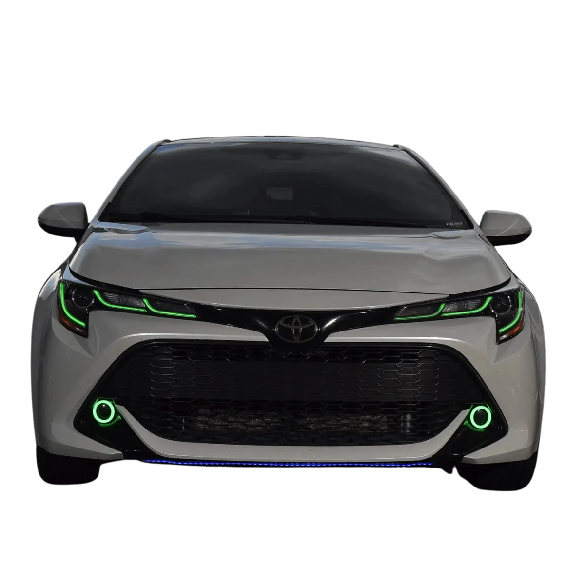 Gray car with green headlight and bumper outlines.