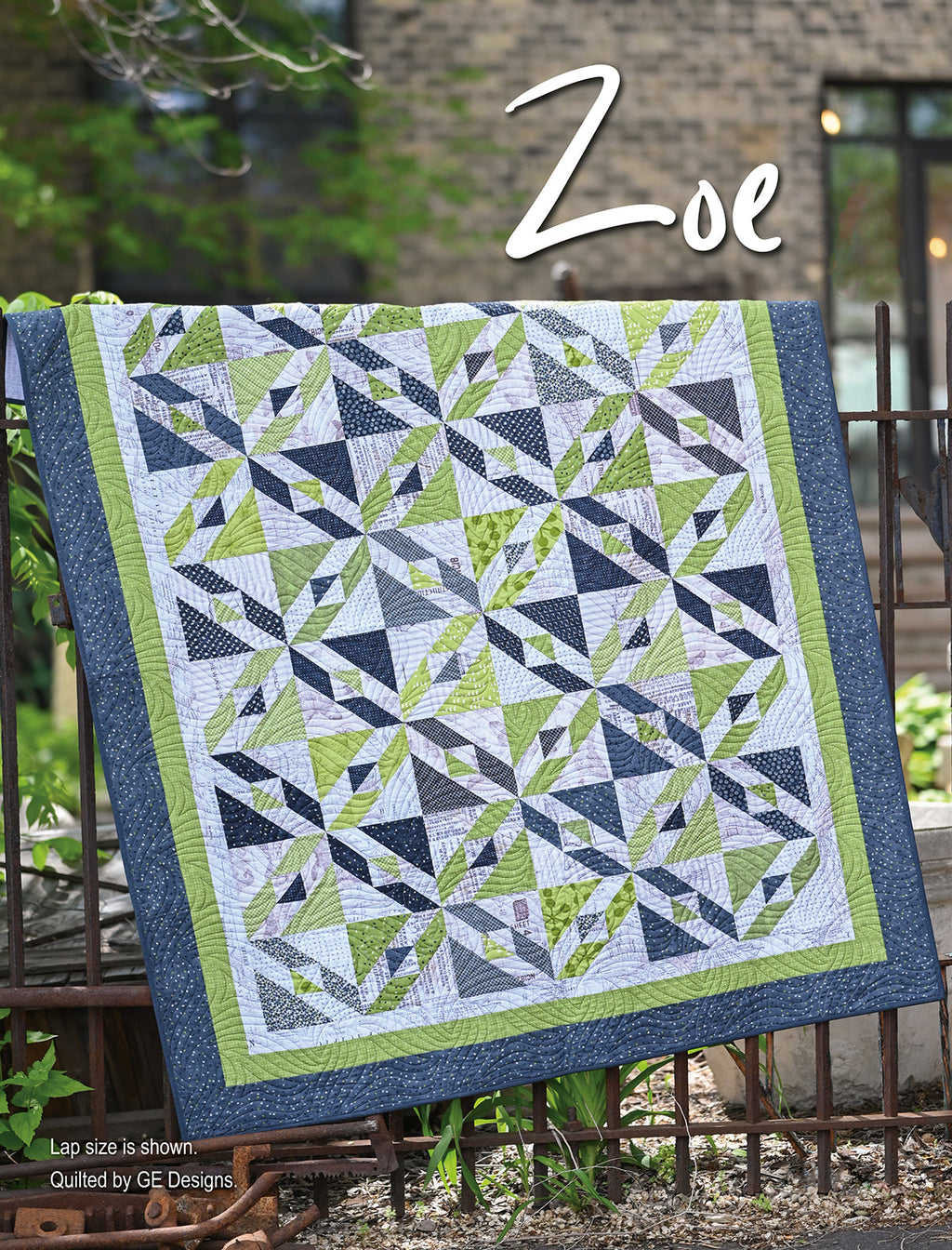 Green and blue geometric quilt labeled Zoe.