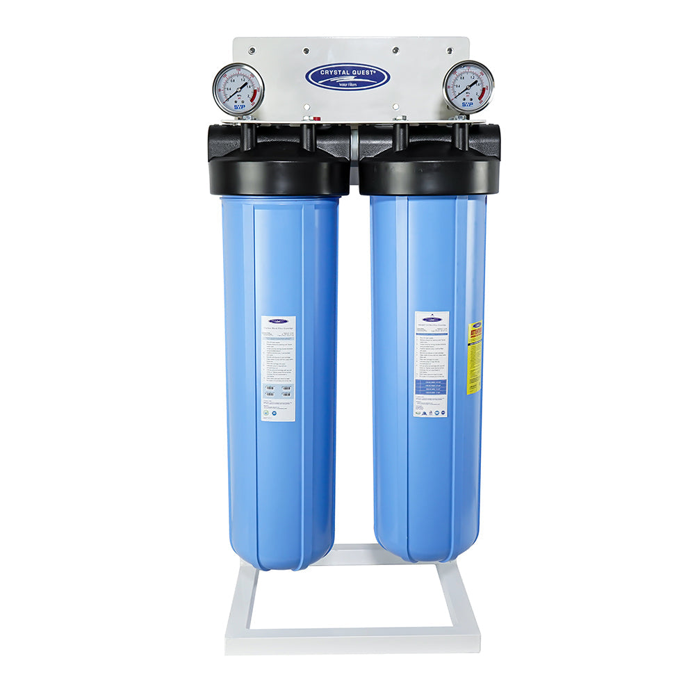 Two blue filter housings with pressure gauges on a white stand.