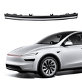 Slim car light bar beside a white car.