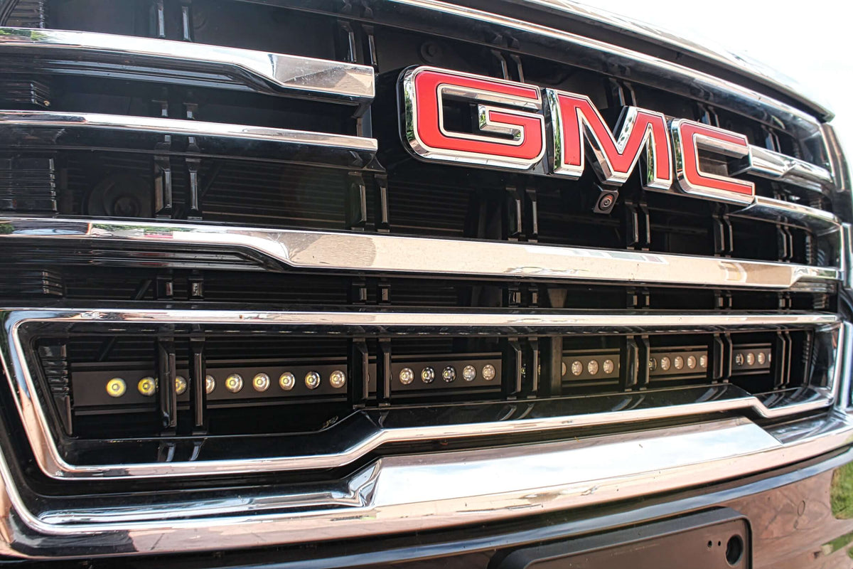 Close-up of GMC grille with installed LED light bar.