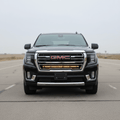 GMC SUV with grille-mounted LED light bar.