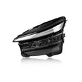 Angled view of black headlight assembly.