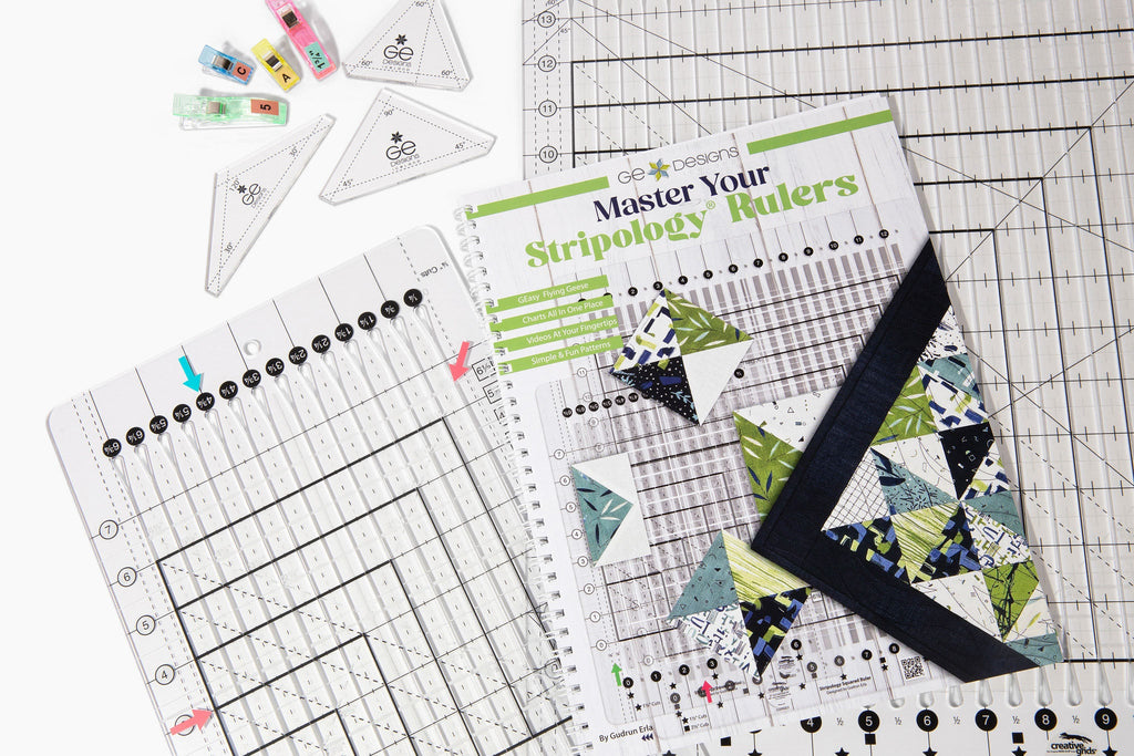 Quilting rulers beside Master Your Stripology Rulers book.