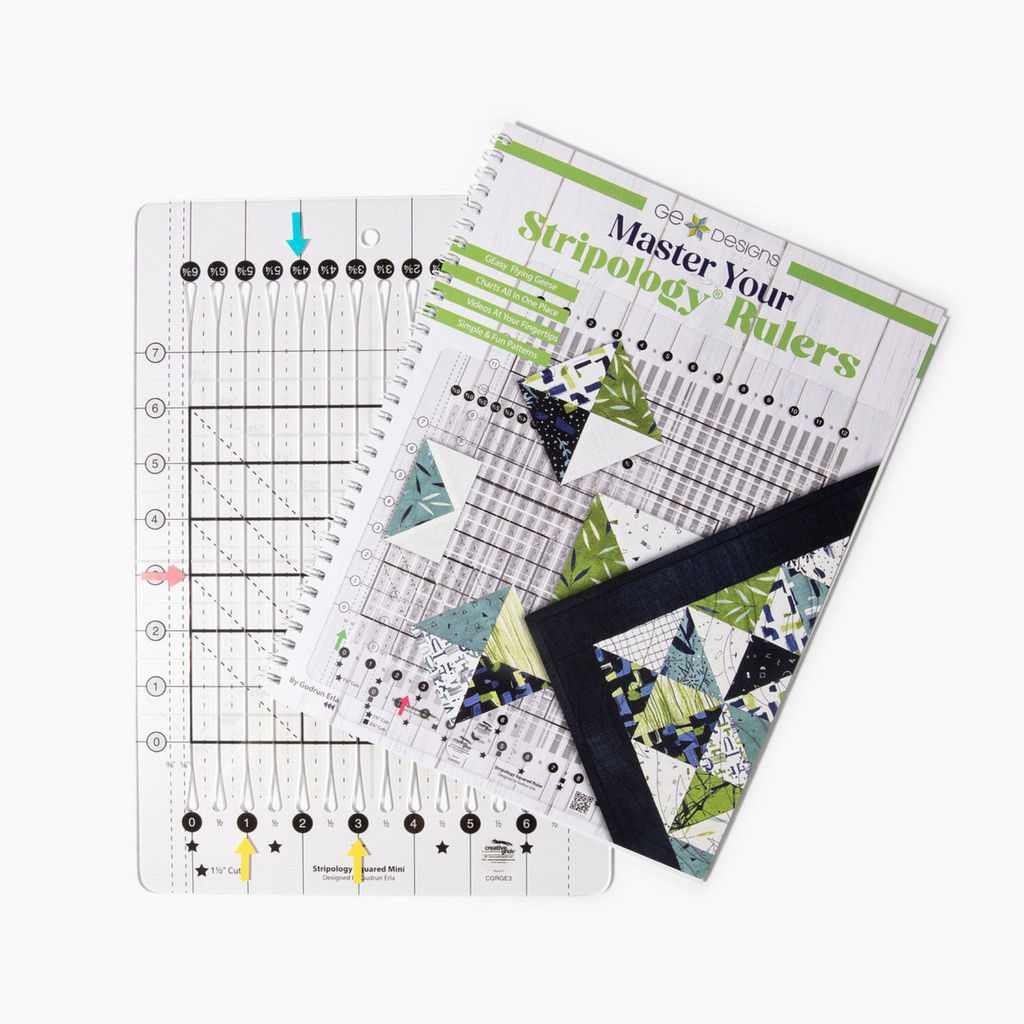 Quilting ruler beside Master Your Stripology Rulers book.