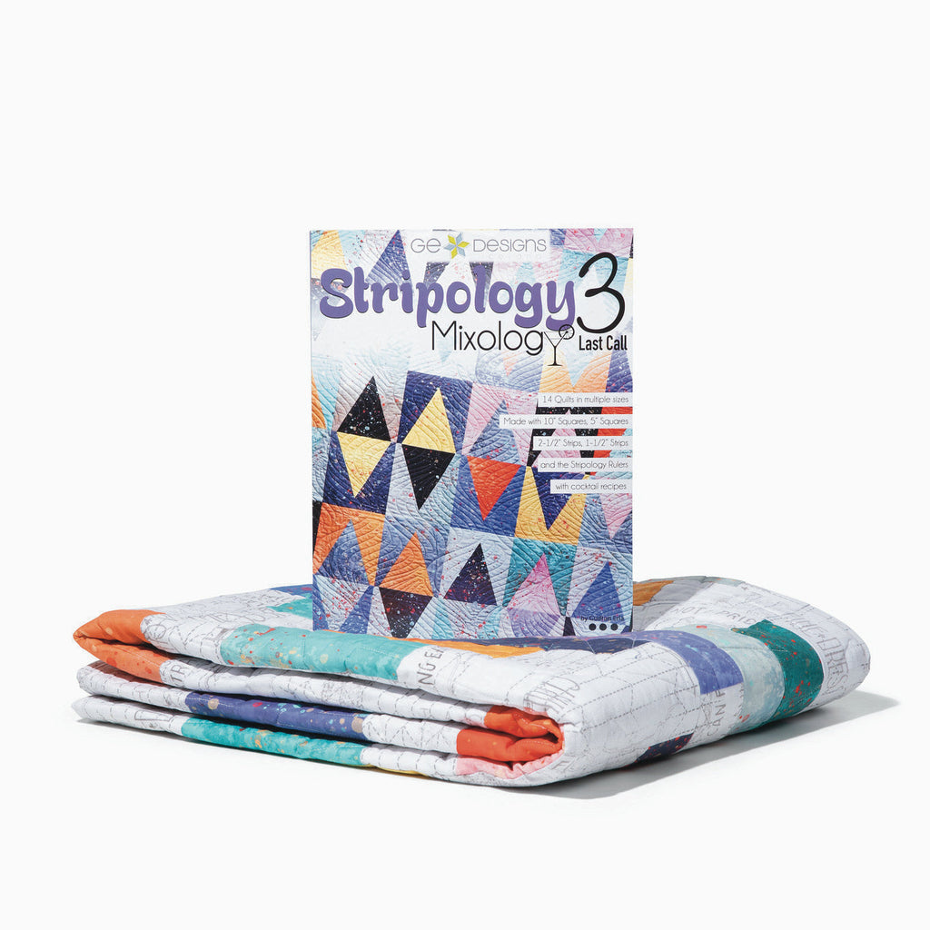 Stripology 3 Mixology book beside folded quilts.